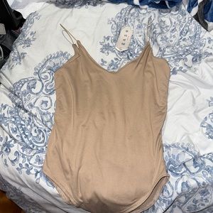 Tan body suit